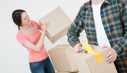 Customer completing a storage booking with documents and keys nearby